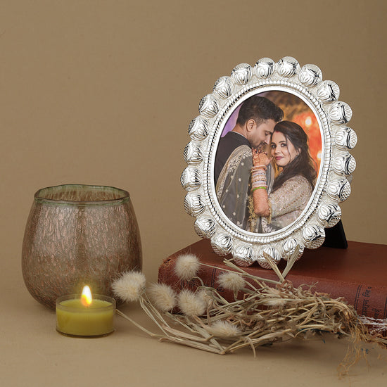 Silver-Plated Oval Photo Frame with Intricate Floral Design